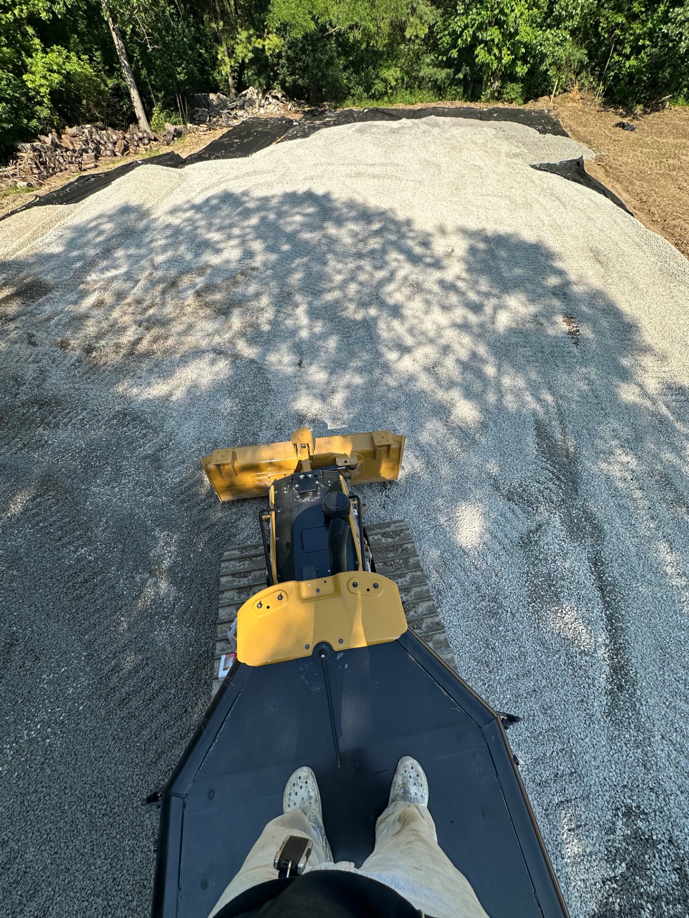 Skid steer grading a new gravel driveway base in Hinckley, Ohio