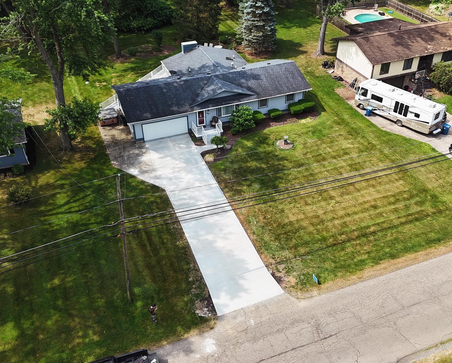 Aerial view of a new concrete driveway at a home in Bath, Ohio