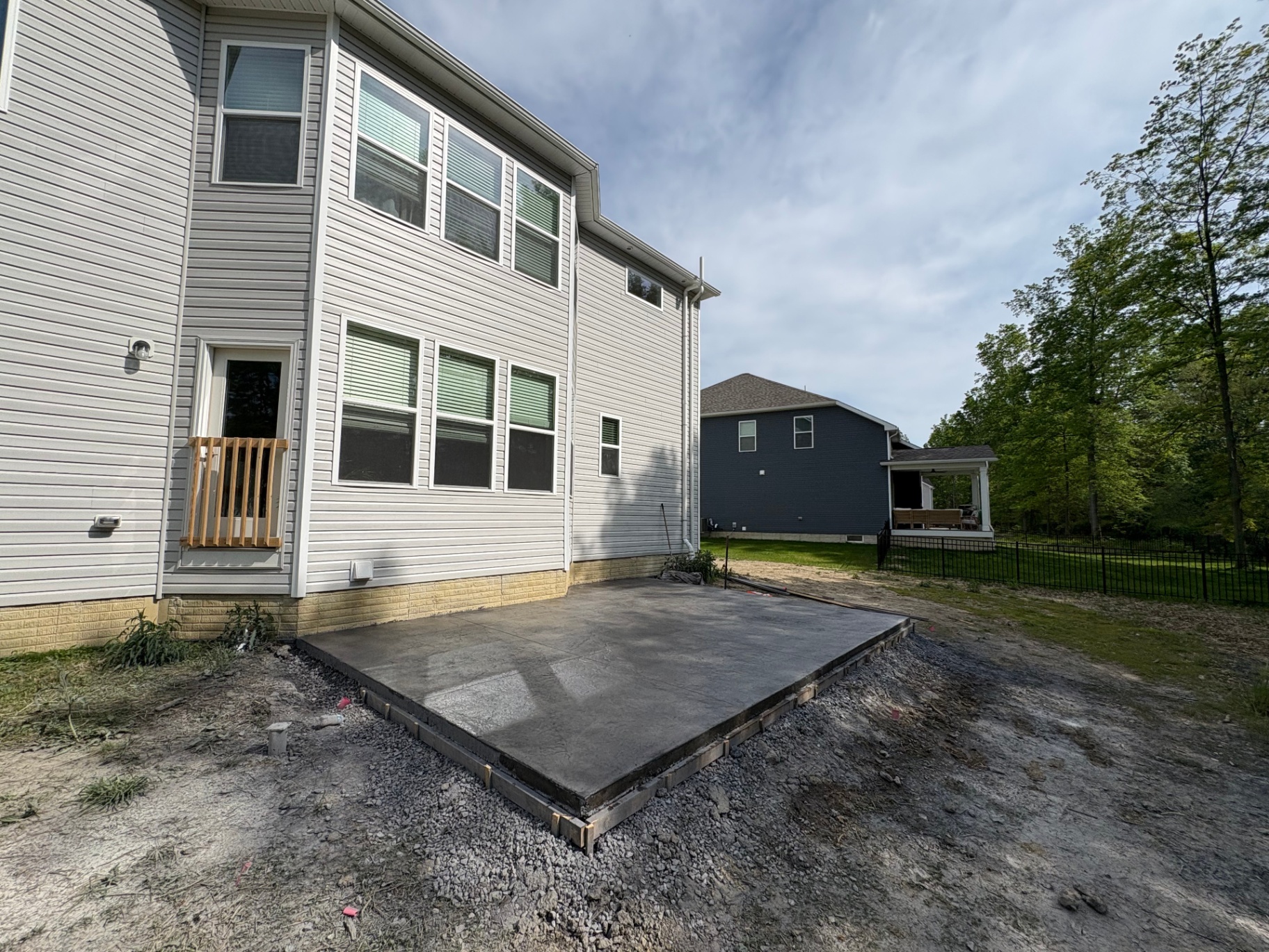 New concrete patio flatwork installation behind a Wadsworth, Ohio home